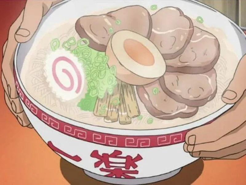 Close-up of an Ichiraku ramen bowl held in two hands